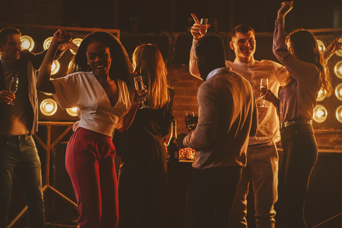 Smiling young people celebrating together at the corporate party